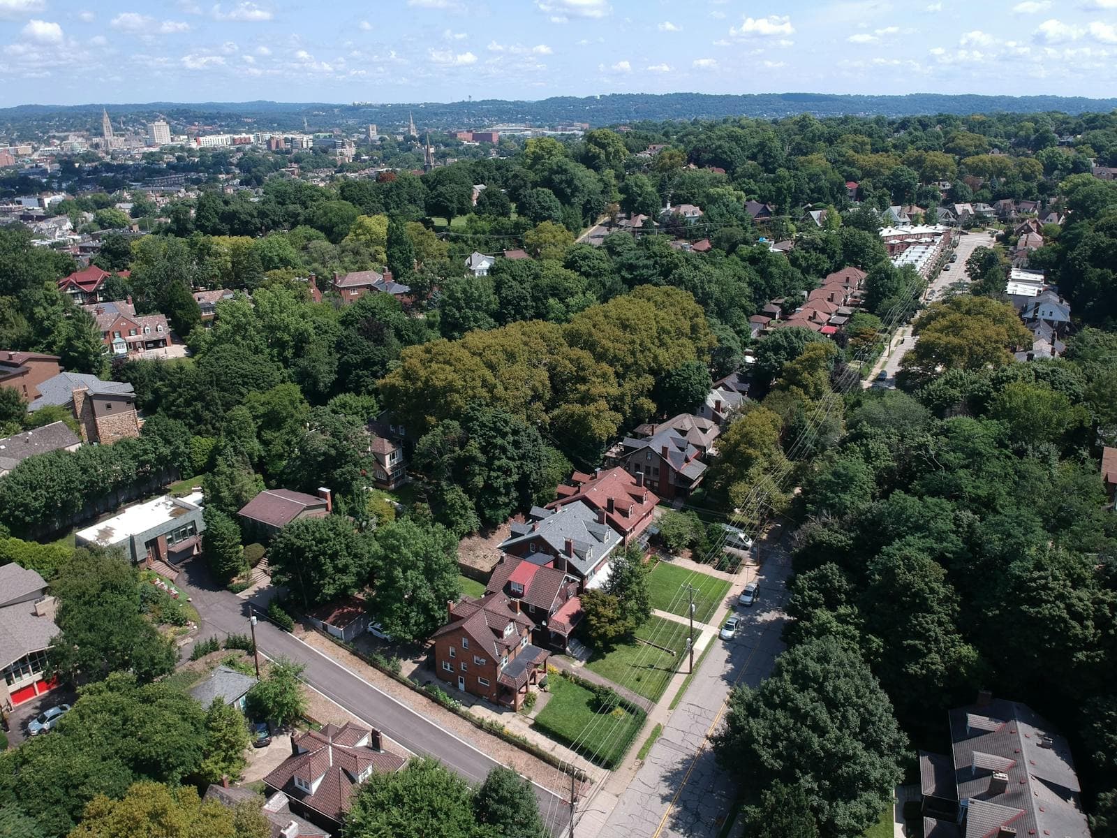 Aerial view of a tree-lined Midwestern suburban neighborhood — Roger's serves residential streets across Eureka, MO and St. Louis County.
